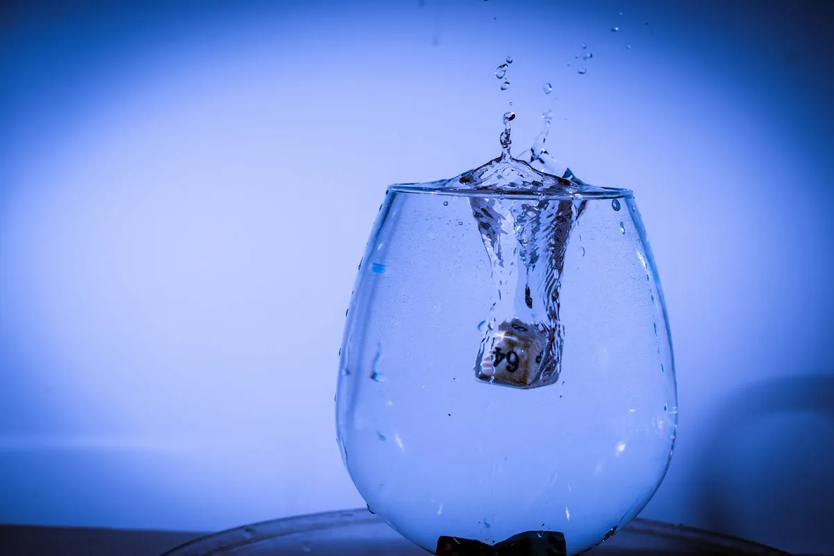 Glass of water overflowing